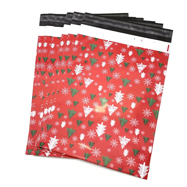 Red poly mailer shipping bags with white snowflake and holiday tree pattern