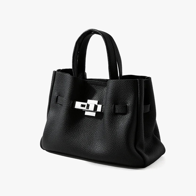 Black genuine leather satchel, old money aesthetic, featuring a metallic silver lock clasp and pebbled texture finish.