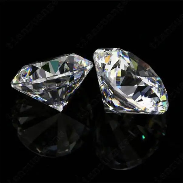 Two elongated lab-grown diamonds with faceted tops, shown side by side