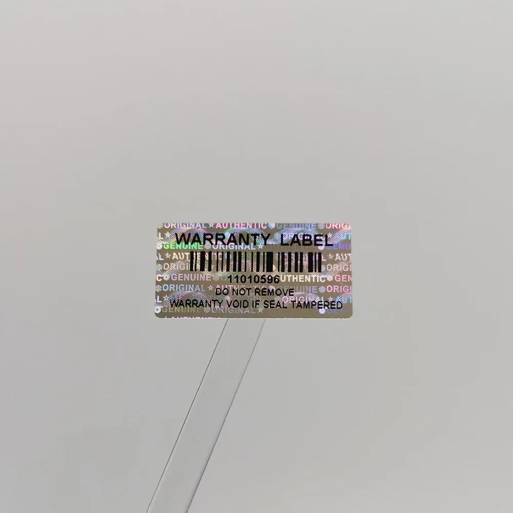 Holographic warranty void label sticker with barcode and serial number, on backing strip