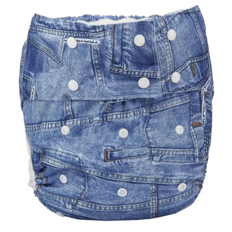 Traveline adjustable baby cloth diaper with denim print design, featuring snap closures for a secure fit.