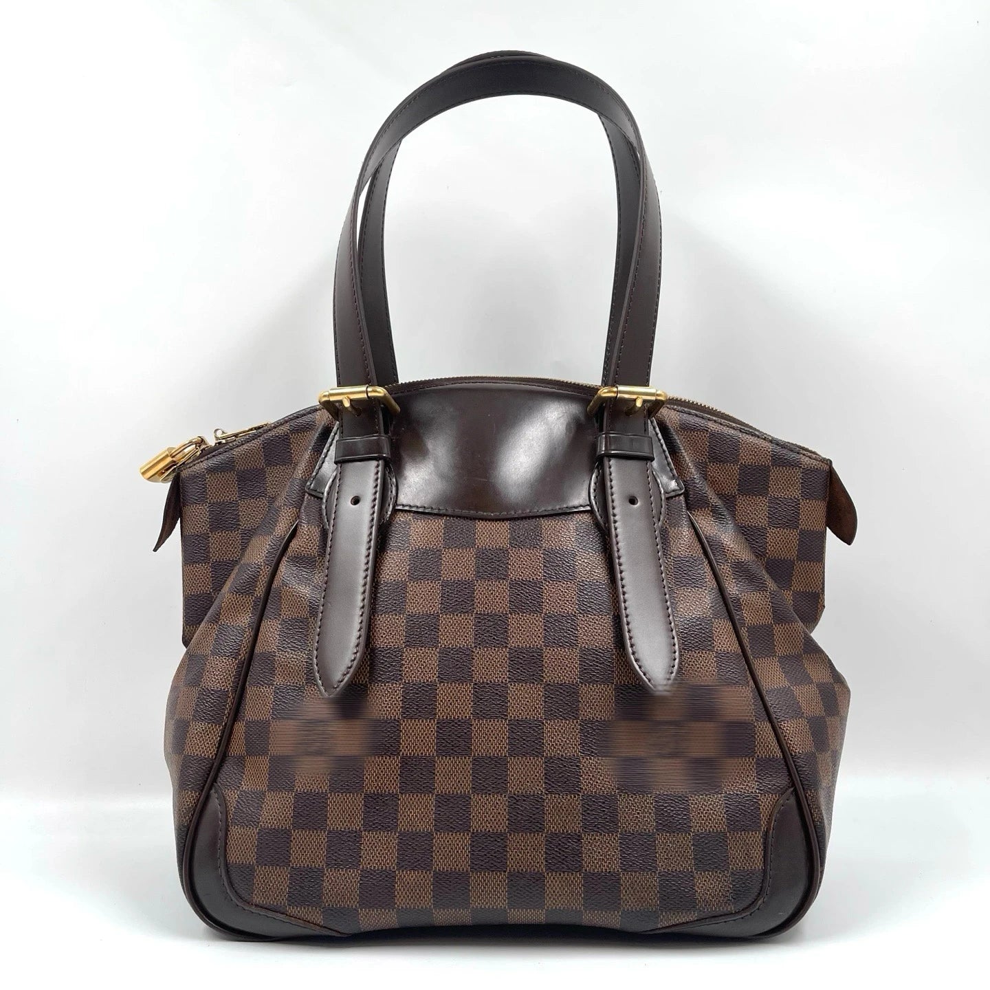 Brown Damier canvas designer shoulder bag with dark leather trim and gold hardware, vintage luxury unisex style.