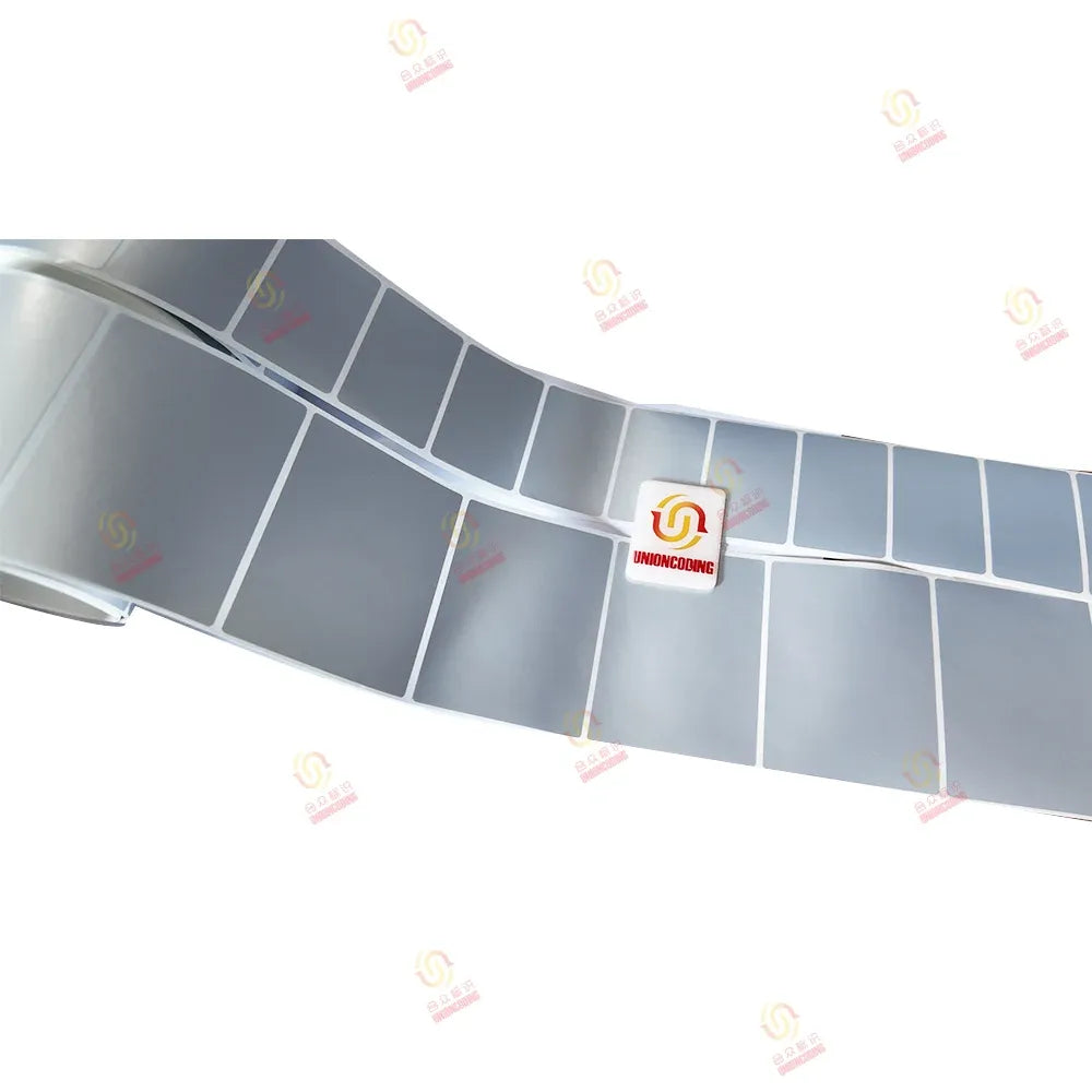 Matte silver self-adhesive label sticker strip with grid-printed rectangles