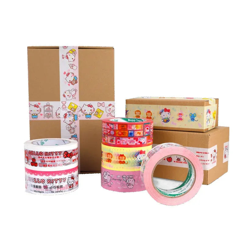 Hello Kitty printed packing tape, multiple rolls and taped cardboard boxes with pastel graphics