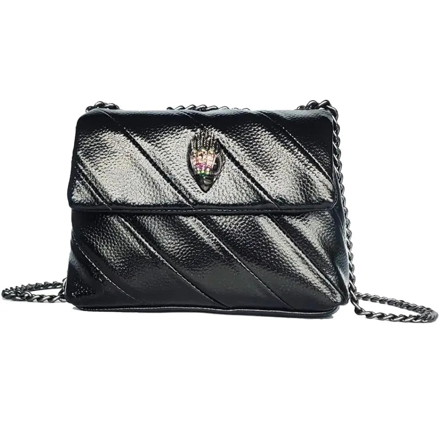 Black quilted crossbody bag with crystal eagle head emblem and chain strap in a structured mini trunk style.