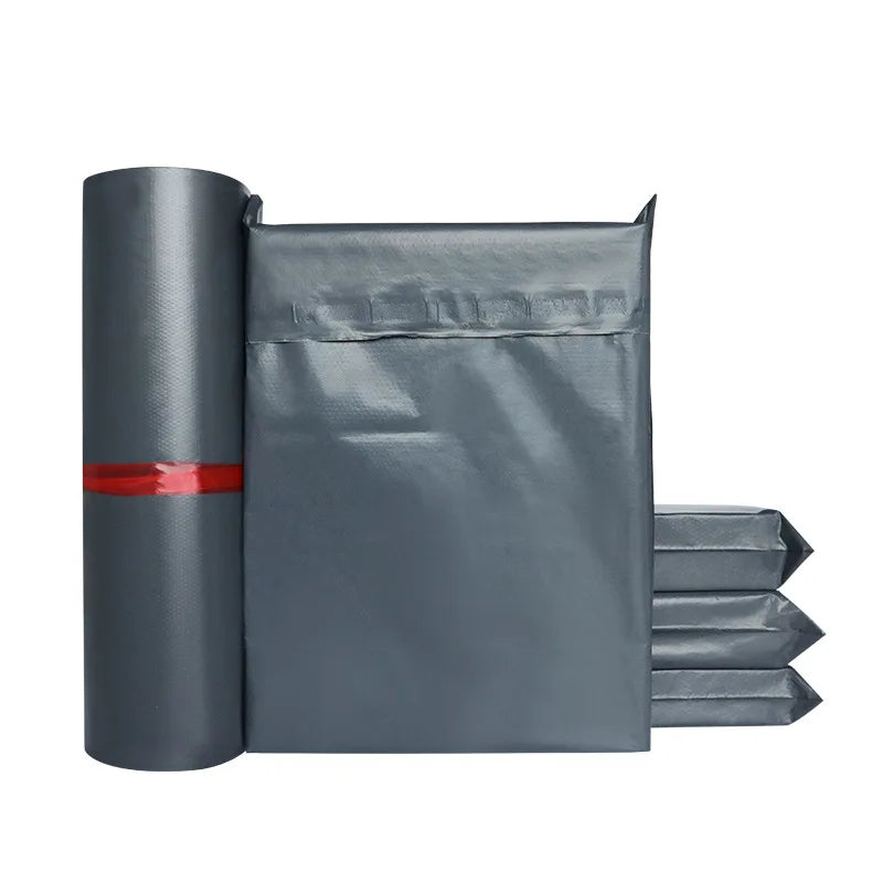 Charcoal plastic shipping mailer envelope with rolled packing film and red band