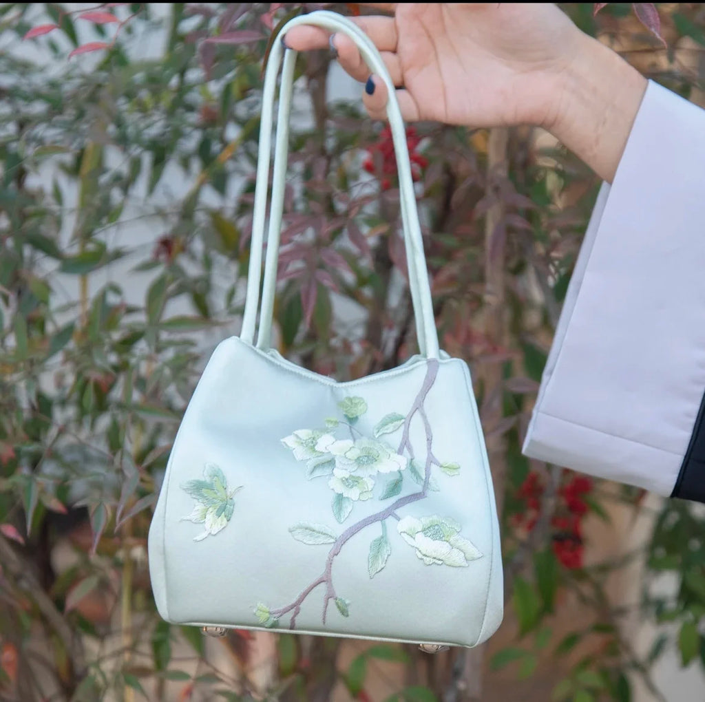 Classic light green satin handbag with delicate floral Su embroidery and twin handles for daily elegant style.