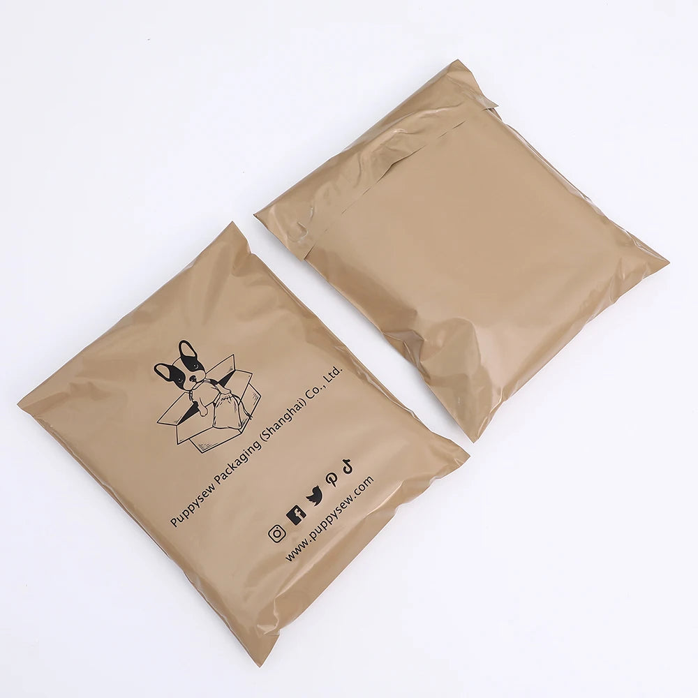 Two brown poly mailer shipping bags with printed logo and website