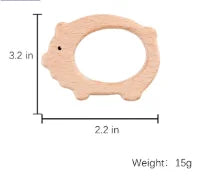 Natural wooden pig teething ring for baby teething relief, beige color.