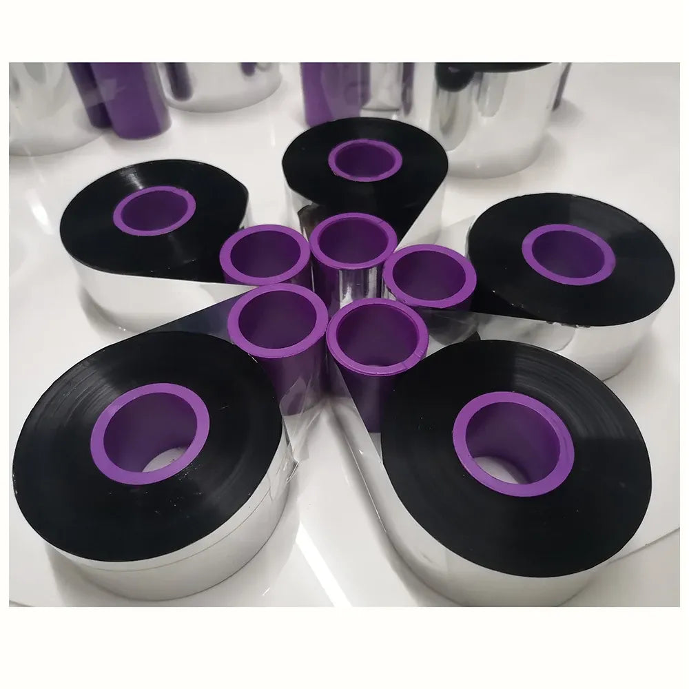 Black thermal transfer ribbon spools with purple inner core and center holes