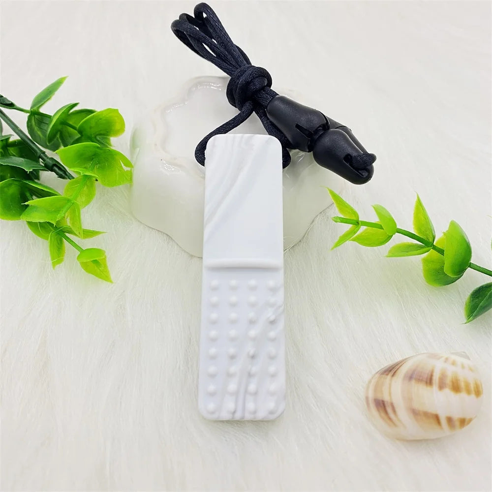 White silicone baby teething toy on a black necklace for soothing gum relief.