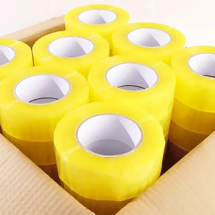Rows of yellow BOPP packaging tape rolls with visible tape core openings