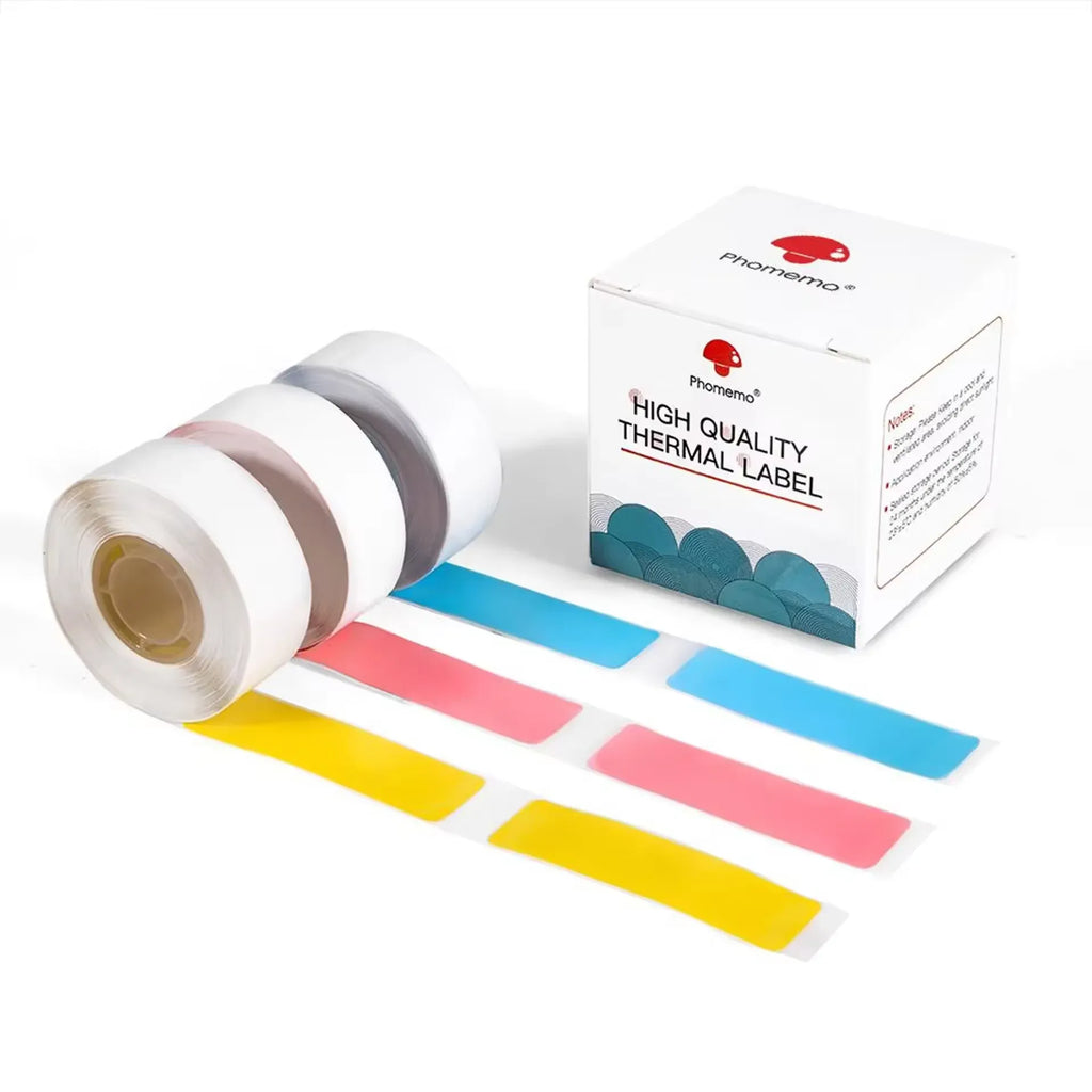 Transparent thermal label tape rolls with blue, red, and yellow label strips and box