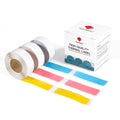 Transparent thermal label tape rolls with blue, red, and yellow label strips and box