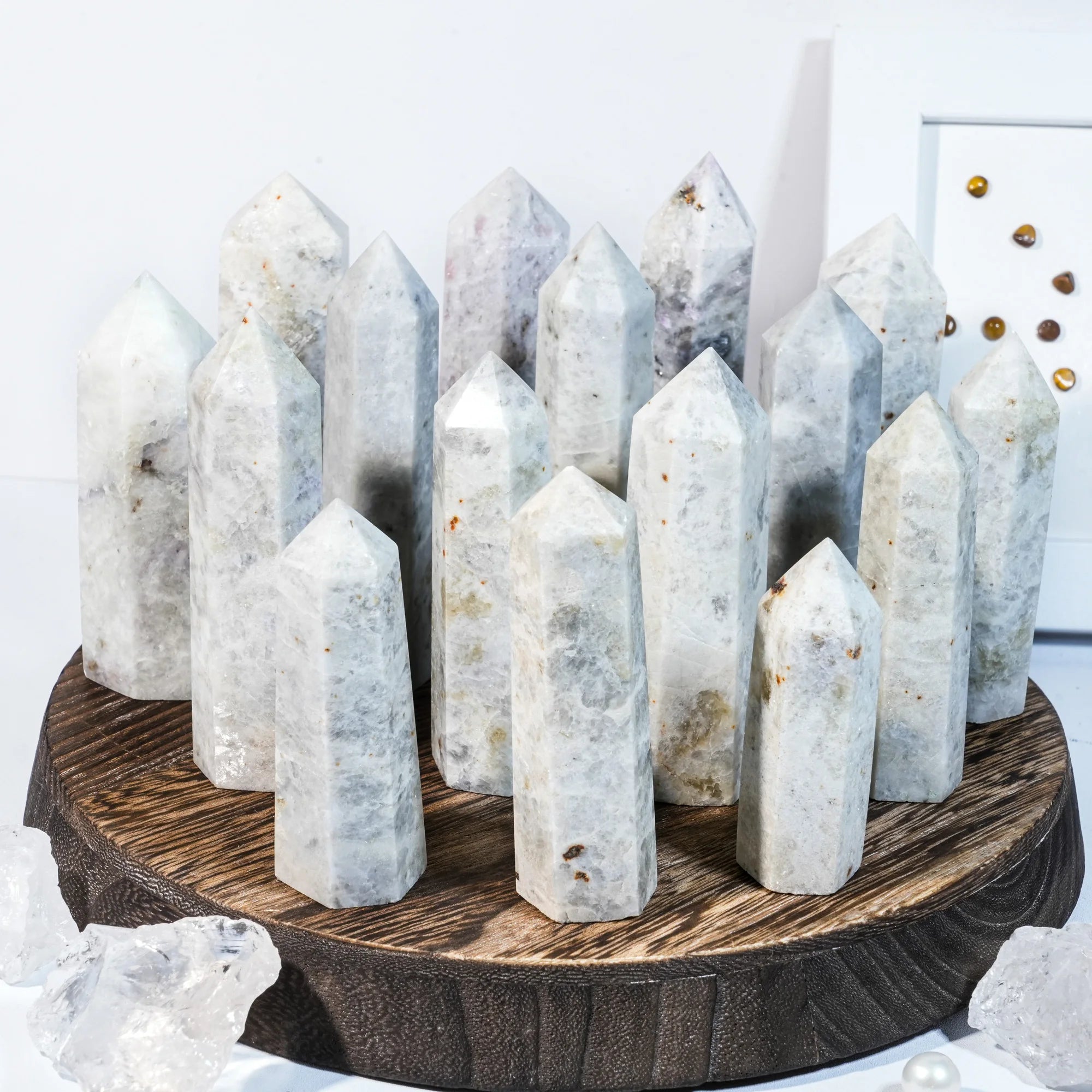 Natural gemstone crystal point tower with multiple pointed stones on a round base.