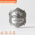 Luxury metal label sticker, embossed ornate frame with CHATEAU CHEVALIER VOYAGE text