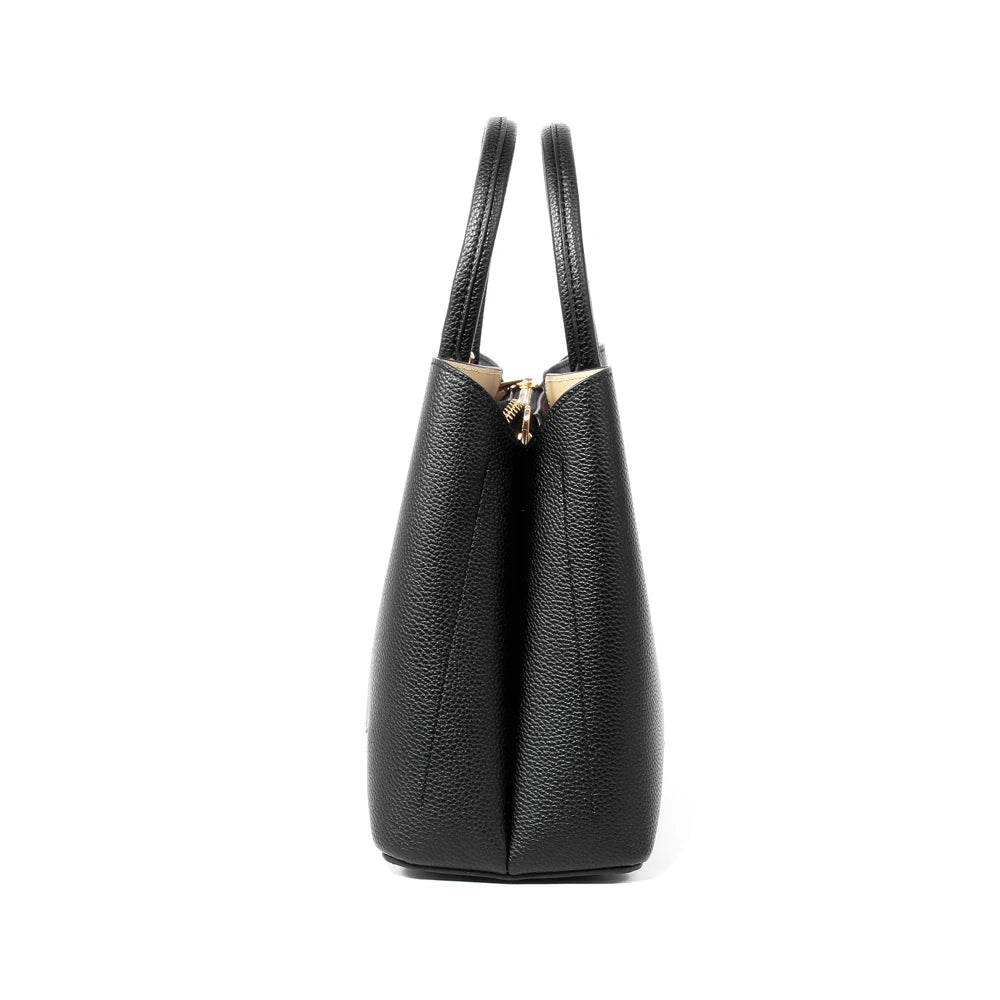 Side view of a black, pebbled PU leather designer handbag with dual handles and a gold zippered top closure.