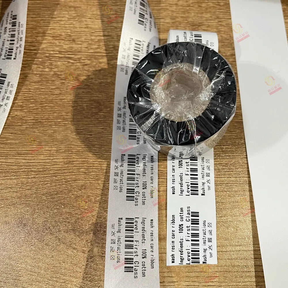 Ink ribbon spool with black outer and barcode stickers