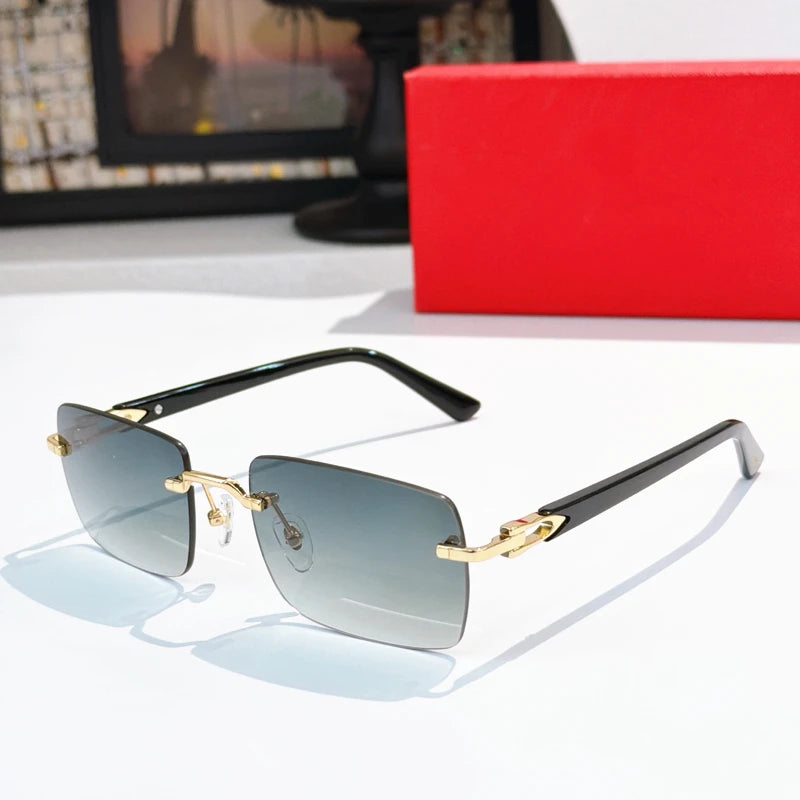 Luxury rimless square sunglasses with gold metal frame, black acetate temples, and grey gradient lenses.