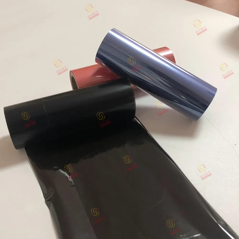 Black resin printer ribbon roll with folded ribbon strip