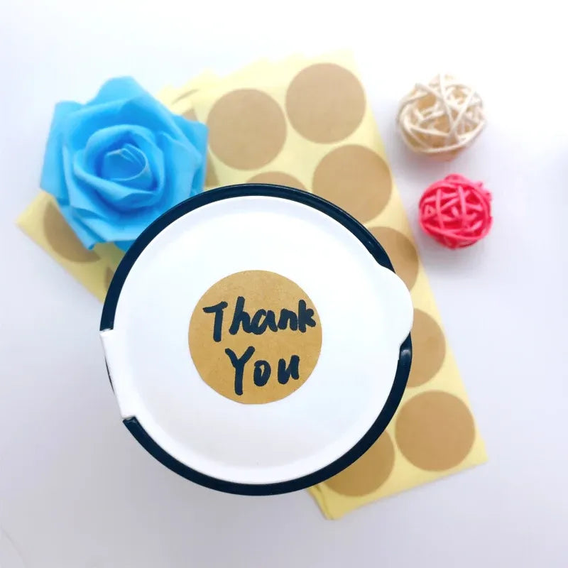 Round kraft paper sticker with printed “Thank You” message for gift notes