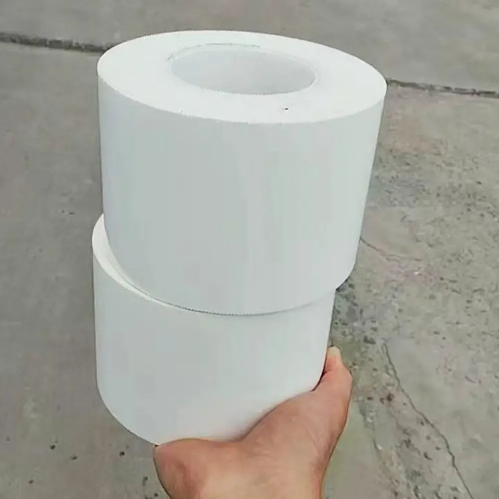 White PE shrink wrap repair tape roll held in hand, large circular core