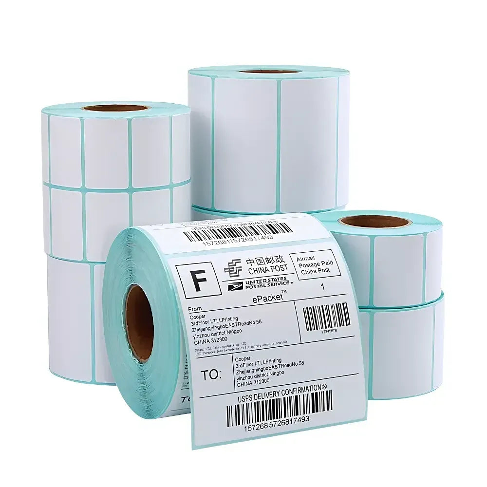 Thermal label rolls with sky-blue edges and a partially printed label sheet