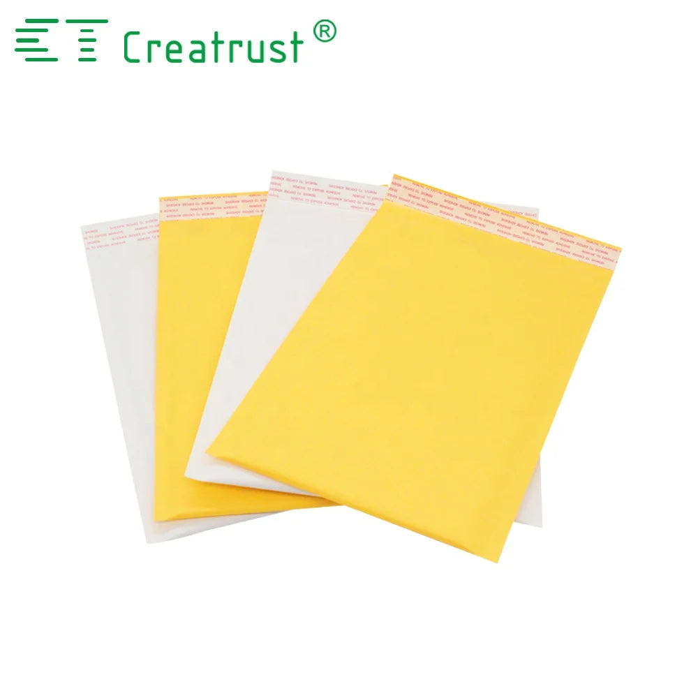 Stacked padded mailing envelopes in yellow and white with fold-over flaps