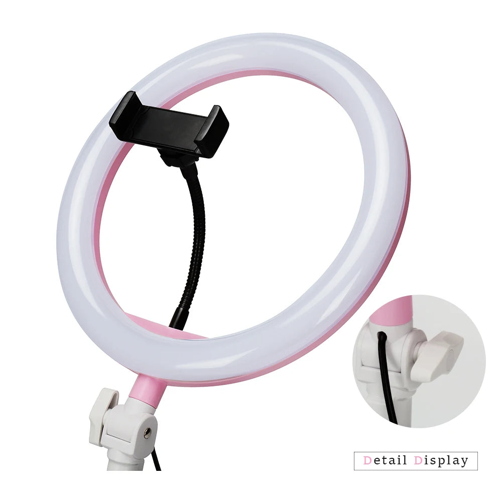 Pink and white ring light with a flexible black phone mount for filming and photography, including an adjustable stand.