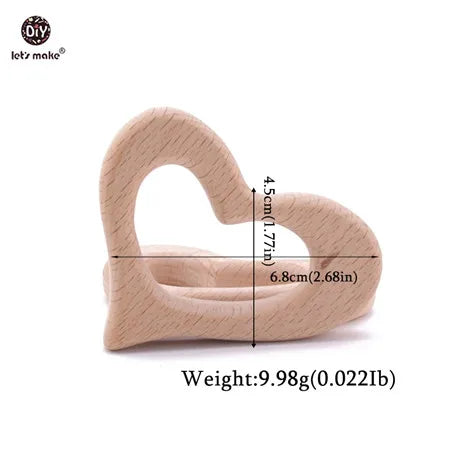 Heart-shaped natural wood baby teething toy in light beige for safe teething relief.
