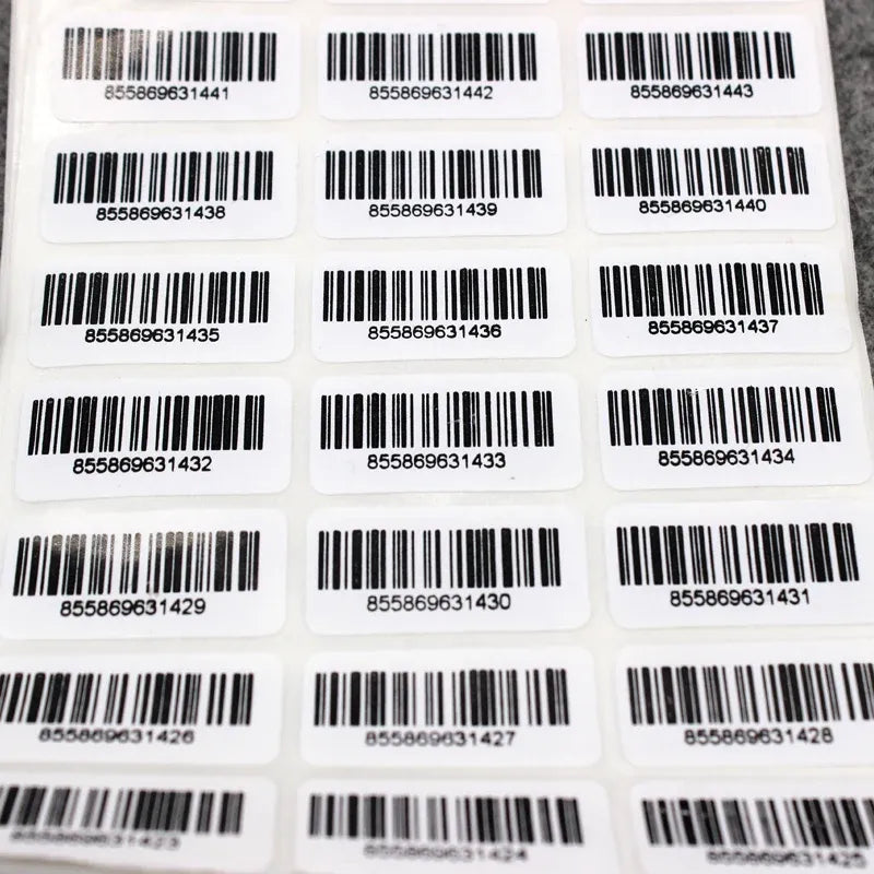 Barcode inventory sticker labels on sheet, white label cards with black barcodes