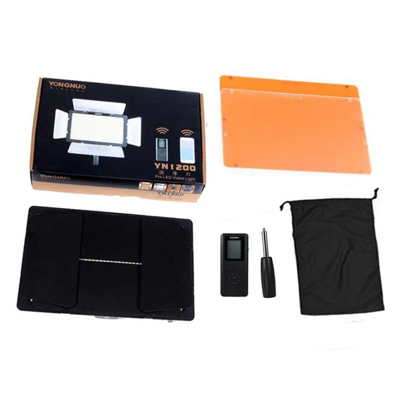 YN1200 LED video light, rectangular panel with barn doors, remote control, orange filter, and black storage bag.