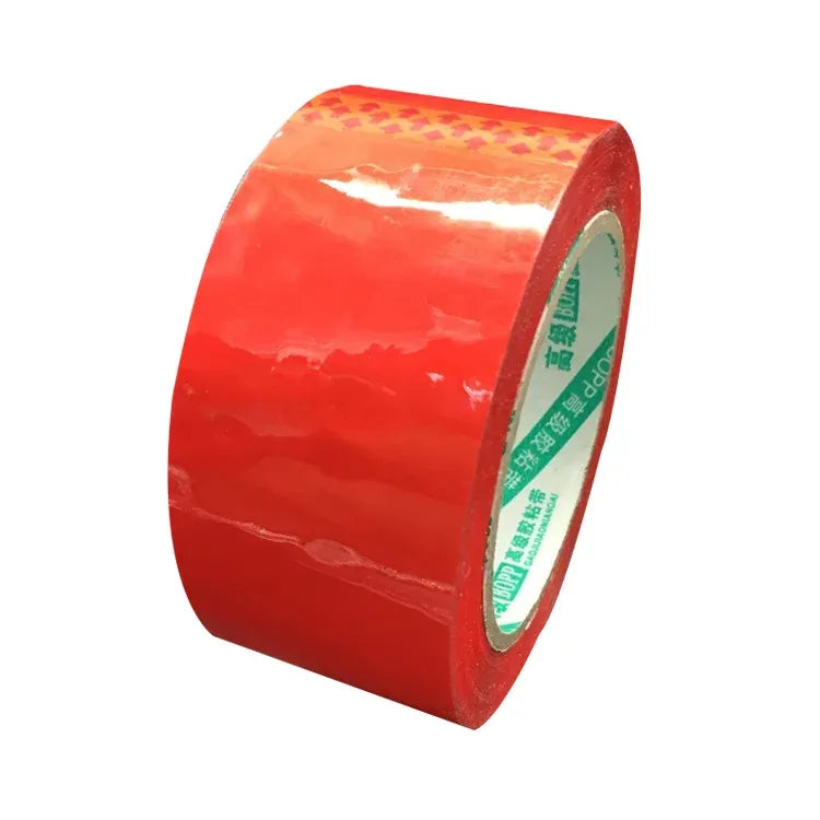 Red acrylic carton sealing tape roll with inner core and exposed adhesive edge