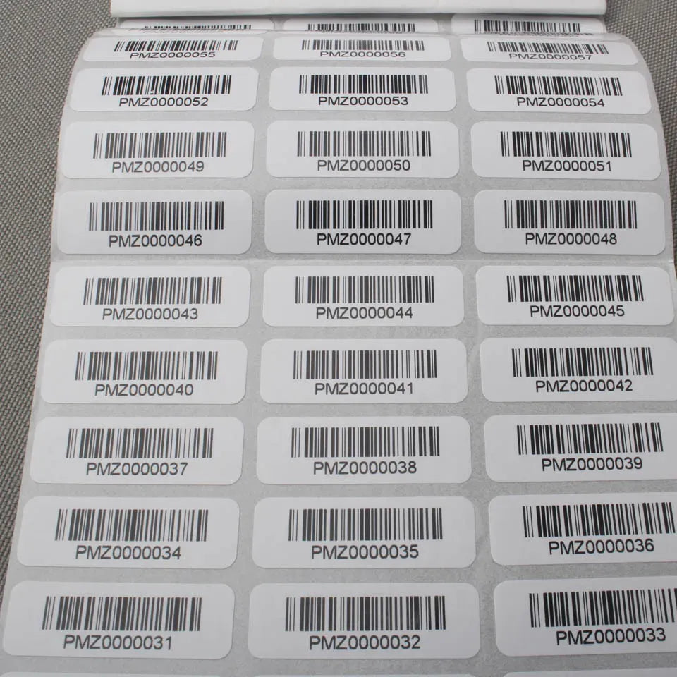 Barcode sticker label sheet with multiple white adhesive labels and barcodes