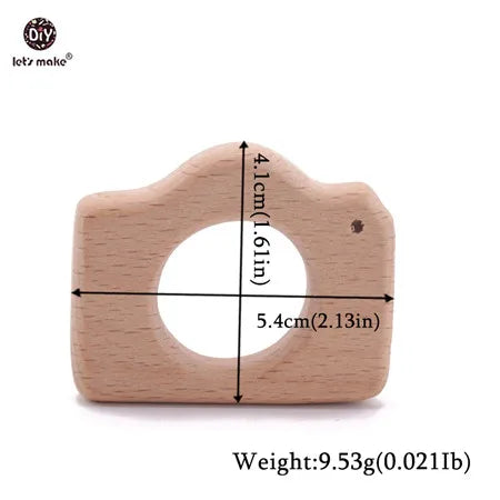 Natural wood camera teething toy in beige for baby teething relief.