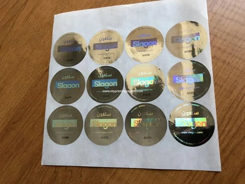 Round holographic adhesive stickers on PET sheet, light gold and dark reflective circles