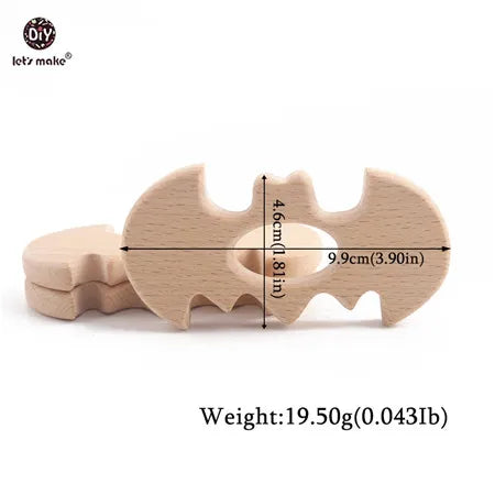 Natural wood bat-shaped baby teething toy in beige for soothing teething pain.