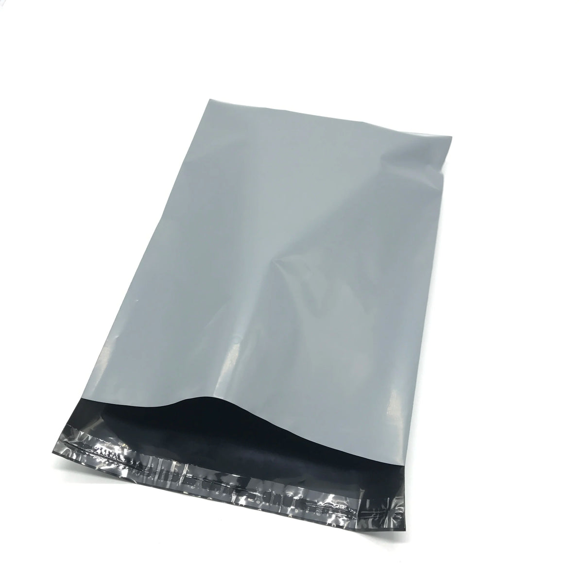 Light gray plastic self-adhesive poly mailer bag with black sealed bottom edge