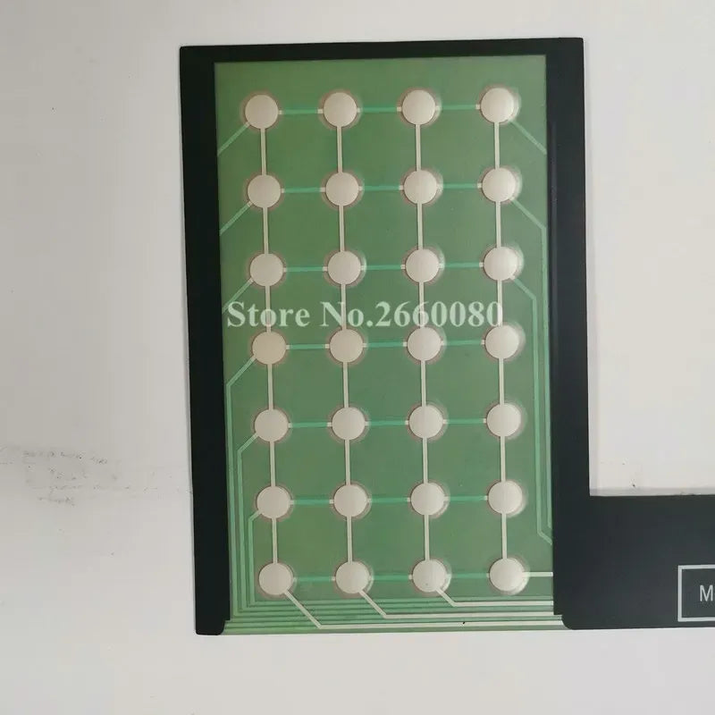 Green keypad film with white circular contact points in grid, framed with black edges