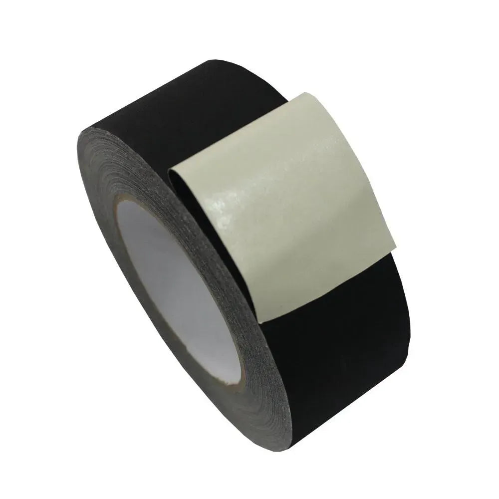 Black cloth tape roll with overlapping beige strip on top