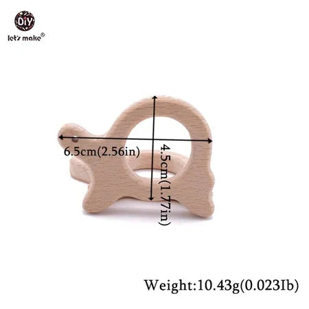Natural wood baby teething toy in turtle shape, light beige color for soothing sore gums.