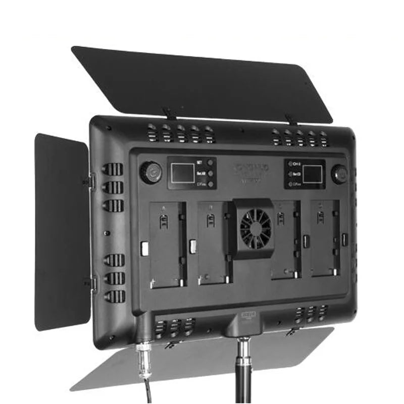 Black rectangular LED panel light with adjustable metal barn doors, cooling fan, and battery mounts for studio lighting.