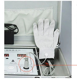 DDS bioelectrical body therapy massager kit with conductive glove and digital control unit in carrying case.