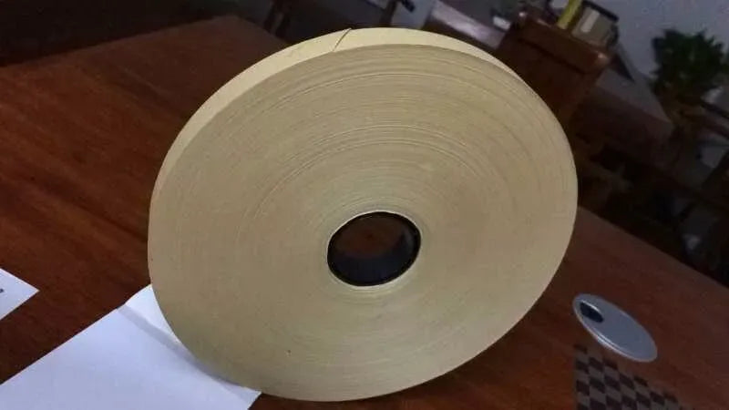 Beige hot melt glue tape roll with center core hole, single-sided adhesive tape