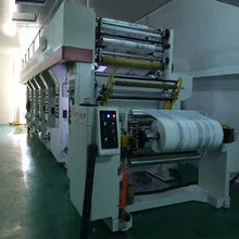 Industrial bubble film machine with stacked rollers and a roll of pink film