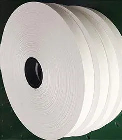 White hot melt glue tape roll with multiple layers, single-sided adhesive, core hole visible