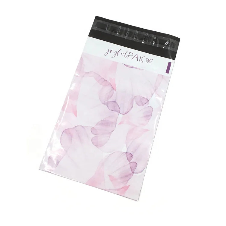 Pink translucent poly mailer bag with black header strip and joyfulPAK logo, floral print