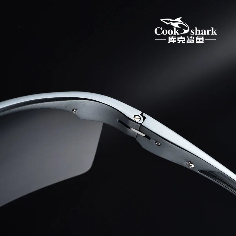 Close-up of matte silver metal sunglasses hinge and frame, focusing on construction detail for durable eyewear.