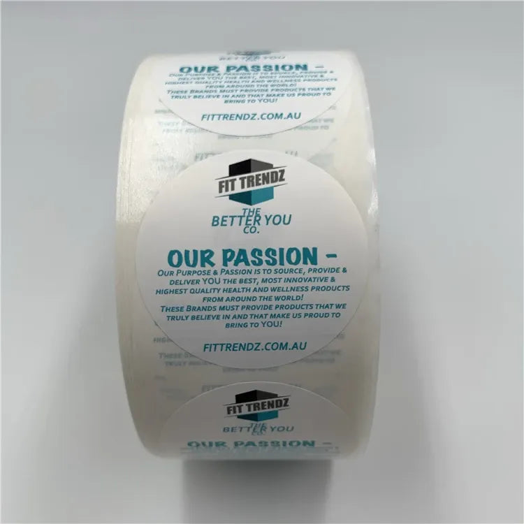 White roll of custom printed label stickers with large circular blue slogan