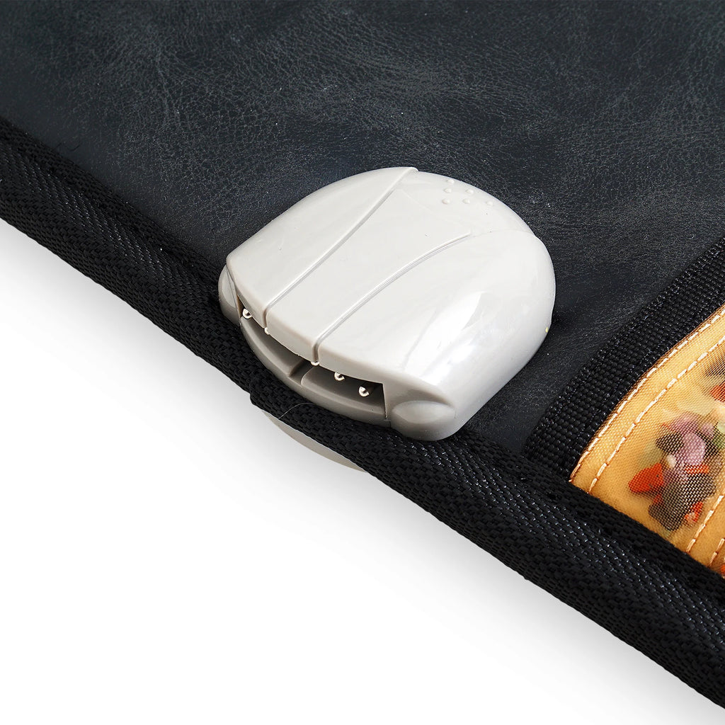 Black leatherette massage mat with a gray plastic remote controller attached to the edge.
